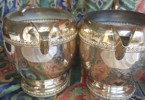 A SET OF TWO VINTAGE SILVER PLATED ROMAN STYLE JUGS