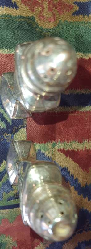 A SET OF ANTIQUE SALT AND PEPPER DISPENSORS STAMPED EP ON LEAD E.16 SOLD AS IS