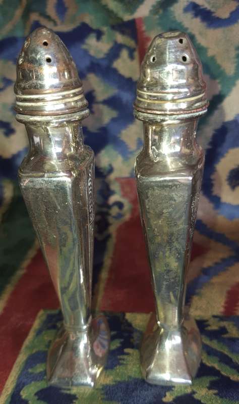 A SET OF ANTIQUE SALT AND PEPPER DISPENSORS STAMPED EP ON LEAD E.16 SOLD AS IS