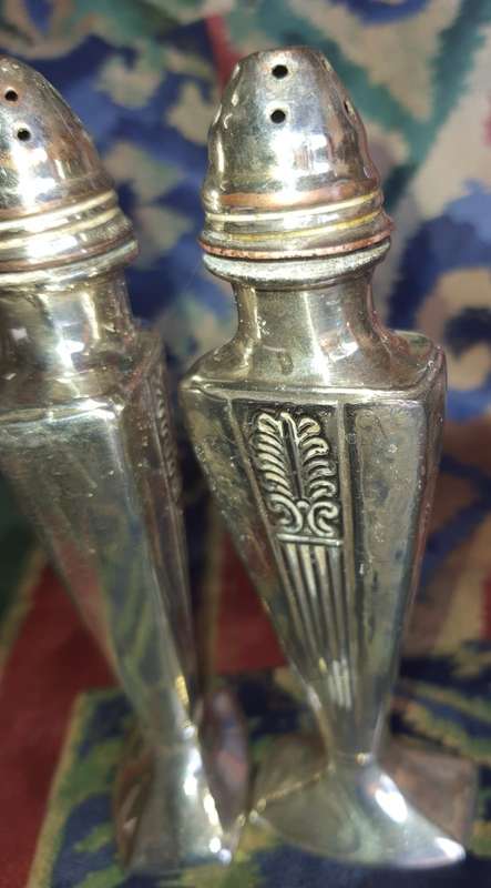 A SET OF ANTIQUE SALT AND PEPPER DISPENSORS STAMPED EP ON LEAD E.16 SOLD AS IS