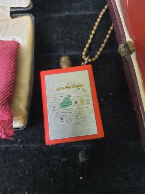 AN ANTIQUE COLLECTION SMOKER COLLECTORS ITEMS RARE LIGHTERS AND A PIPE SOLD AS IS