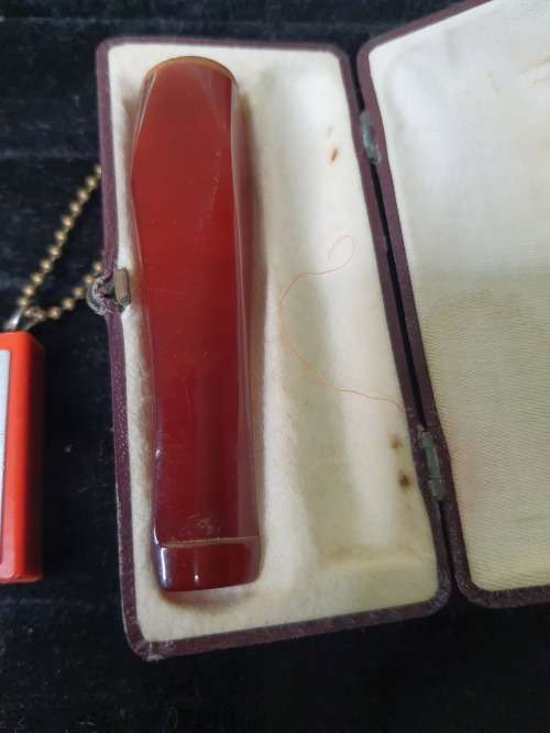 AN ANTIQUE COLLECTION SMOKER COLLECTORS ITEMS RARE LIGHTERS AND A PIPE SOLD AS IS