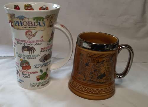 TWO COLLECTORS CERAMIC BEER MUGS SOLD AS IS