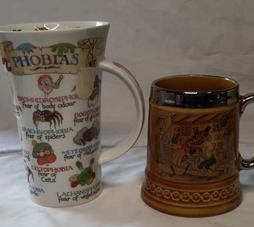 TWO COLLECTORS CERAMIC BEER MUGS SOLD AS IS