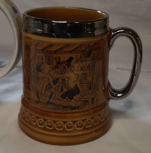 TWO COLLECTORS CERAMIC BEER MUGS SOLD AS IS