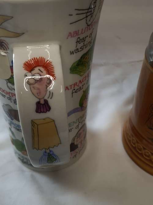 TWO COLLECTORS CERAMIC BEER MUGS SOLD AS IS