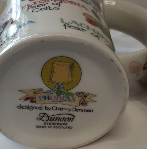 TWO COLLECTORS CERAMIC BEER MUGS SOLD AS IS