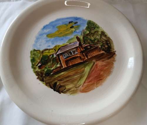 A CABIN IN THE WOODS BY JORDAN 99 PORCELAIN WALL PLAQUE SOLD AS IS