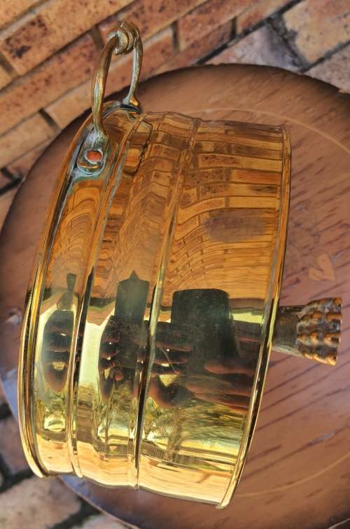 A VINTAGE ROUND SMALLER BRASS PLANTER