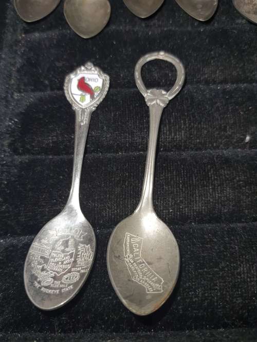 A COLLECTION OF VINTAGE TEASPOONS SOLD AS IS