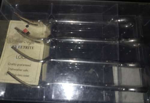A SET OF LOOP EETRITE COCKTAIL FORKS