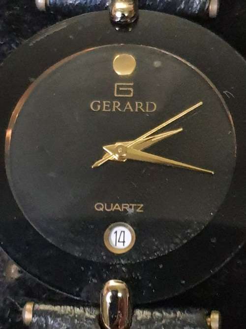 A COLLECTION OF GENTS MIDSIZE WATCHES ONE WITH A GENUINE DIAMOND