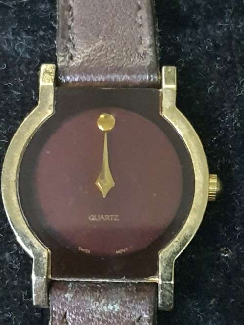 A COLLECTION OF GENTS MIDSIZE WATCHES ONE WITH A GENUINE DIAMOND