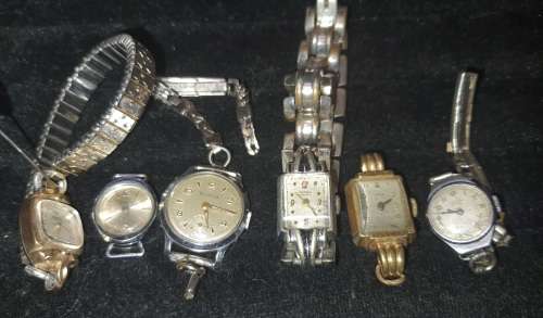A COLLECTION OF VINTAGE AND ANTIQUE WOMANS WATCHES SOLD AS IS NOT TESTED [ E1]