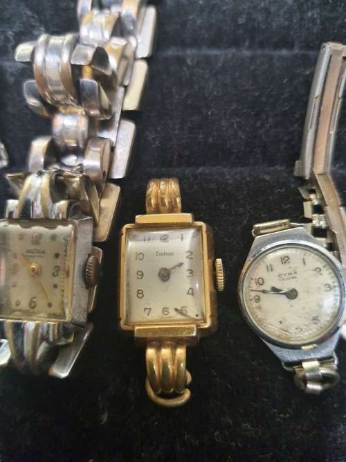 A COLLECTION OF VINTAGE AND ANTIQUE WOMANS WATCHES SOLD AS IS NOT TESTED [ E1]