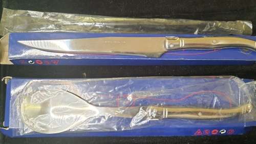 TWO VINTAGE FRENCH LAGUIOLE PRODUCTION CUTTLERY CARVING KNIVE AND A TABLE SPOON SOLD AS IS