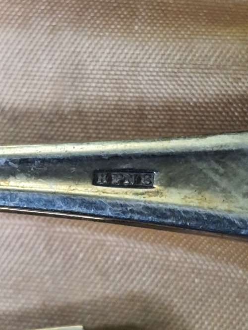 AN ANTIQUE DESERT CAKE SERVING SET IN ITS ORIGINAL BROWM CASE SOLD AS IS