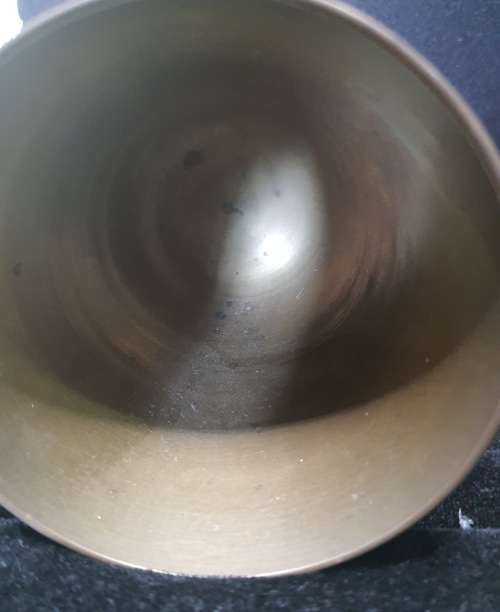 A VINTAGE BRASS WINE INGOT AND A BRASS VASE SOLD AS IS