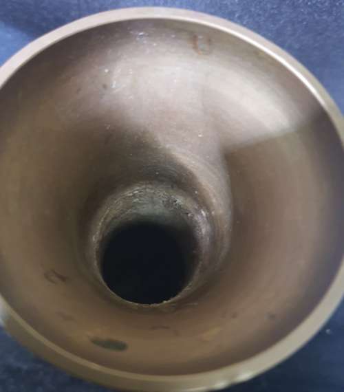 A VINTAGE BRASS WINE INGOT AND A BRASS VASE SOLD AS IS