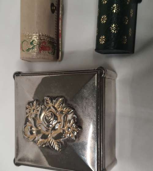 A COLLECTION OF WOMANS LIPS STICK POUCHES AND A SILVER PLATED JEWELRY BOX SOLD AS IS