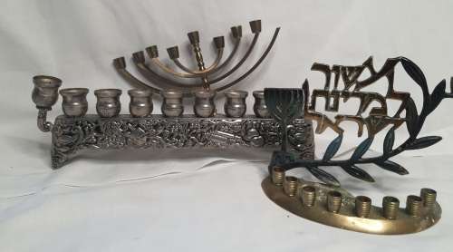 A COLLECTION OF JEWISH MINORAHS SOLD AS IS