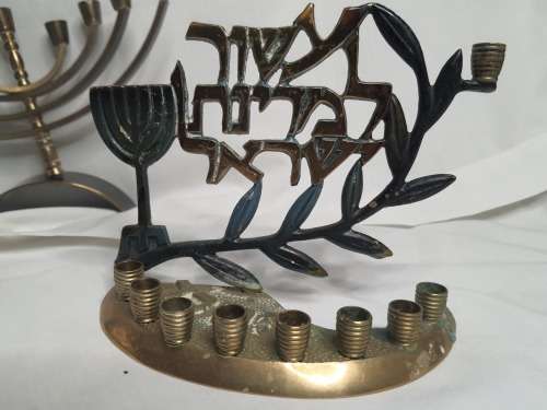 A COLLECTION OF JEWISH MINORAHS SOLD AS IS