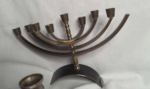 A COLLECTION OF JEWISH MINORAHS SOLD AS IS
