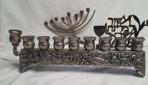 A COLLECTION OF JEWISH MINORAHS SOLD AS IS