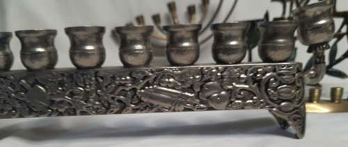 A COLLECTION OF JEWISH MINORAHS SOLD AS IS
