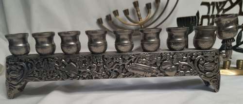 A COLLECTION OF JEWISH MINORAHS SOLD AS IS