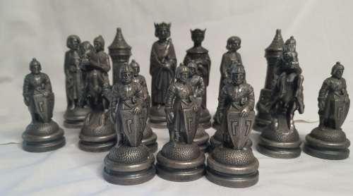 A  VINTAGE COLLECTION OF ALLOY CHESS PIECES , ITS NOT THE COMPLETE SET SOLD AS IS
