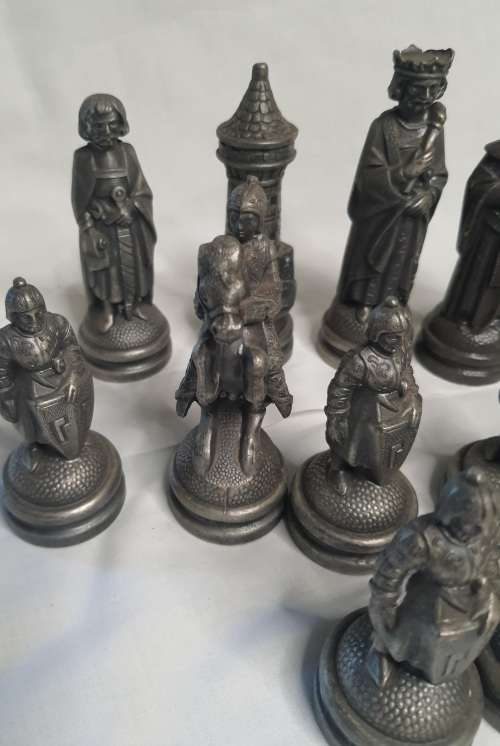 A  VINTAGE COLLECTION OF ALLOY CHESS PIECES , ITS NOT THE COMPLETE SET SOLD AS IS