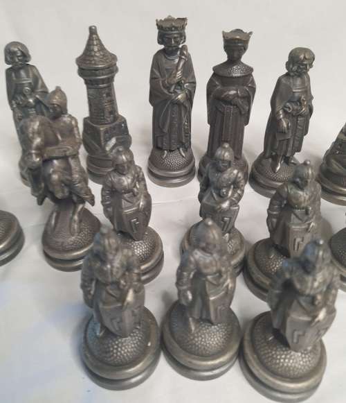A  VINTAGE COLLECTION OF ALLOY CHESS PIECES , ITS NOT THE COMPLETE SET SOLD AS IS
