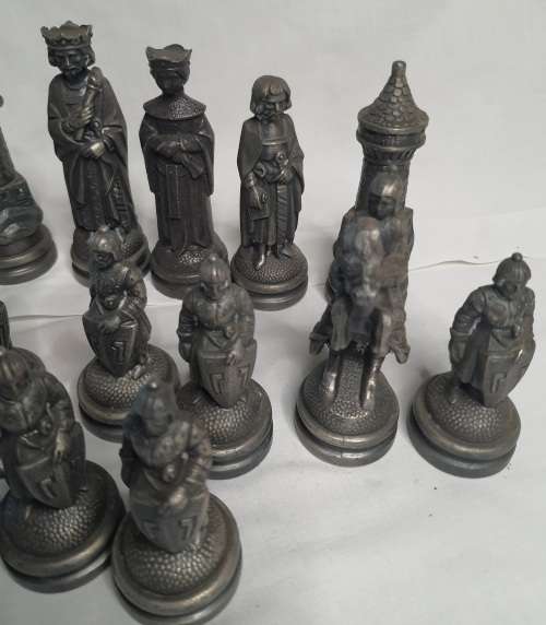 A  VINTAGE COLLECTION OF ALLOY CHESS PIECES , ITS NOT THE COMPLETE SET SOLD AS IS