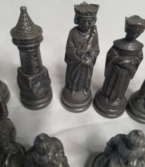 A  VINTAGE COLLECTION OF ALLOY CHESS PIECES , ITS NOT THE COMPLETE SET SOLD AS IS