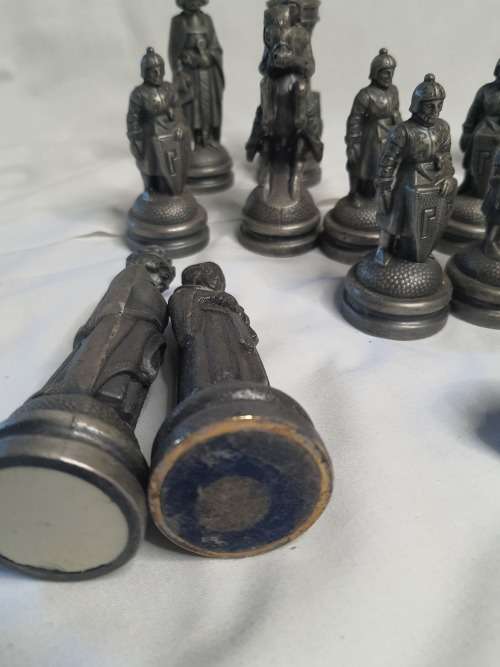 A  VINTAGE COLLECTION OF ALLOY CHESS PIECES , ITS NOT THE COMPLETE SET SOLD AS IS