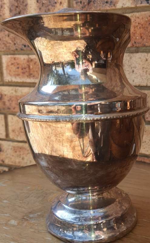 A ROMAN STYLE EPNS WATER OR WINE JUG SOLD AS IS