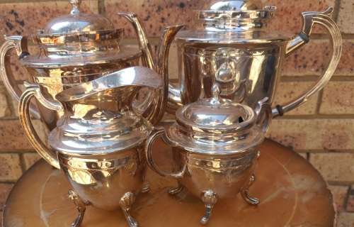 A VINTAGE SILVER PLATED TEA SET ,
