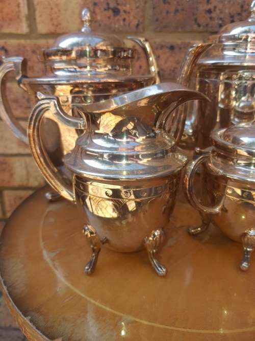 A VINTAGE SILVER PLATED TEA SET ,