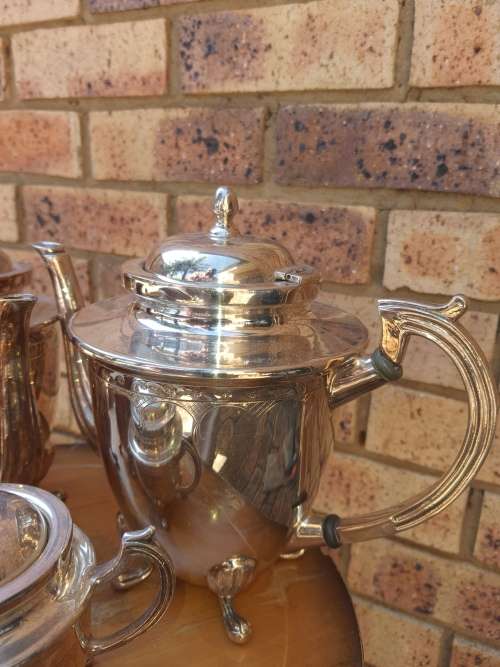 A VINTAGE SILVER PLATED TEA SET ,