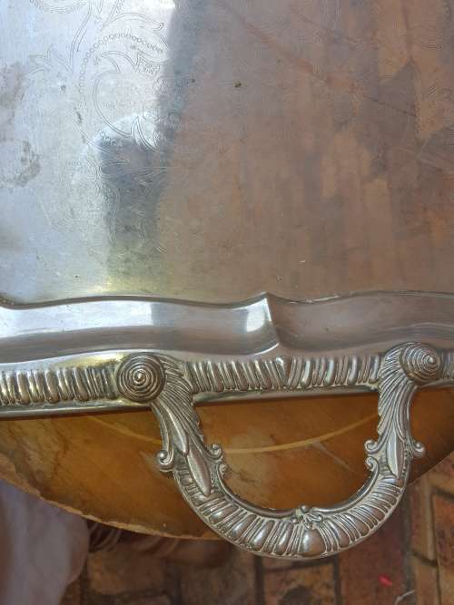 A VINTAGE EDWARDIAN STYLE SILVER PLATED SERVING  TRAY SOLD AS IS