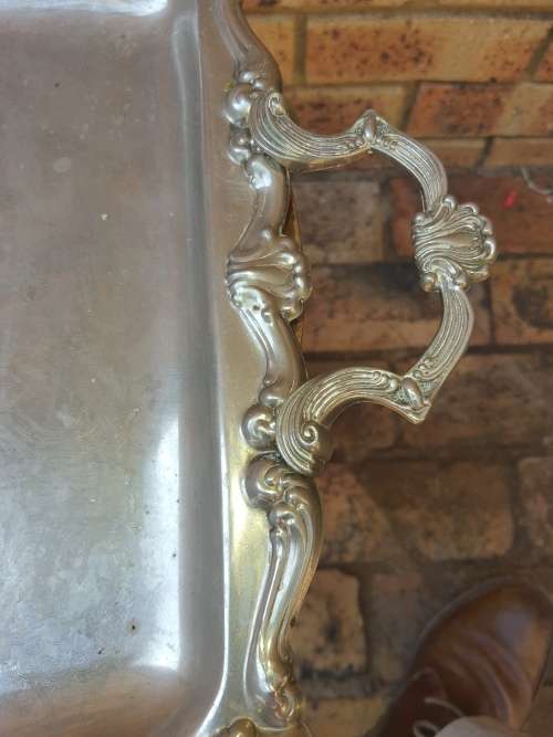 AN EDWARDIAN STYLE SILVER PLATED SERVING TRAY LARGE VERY ORNATE IN DESIGN TRAY SOLD AS IS