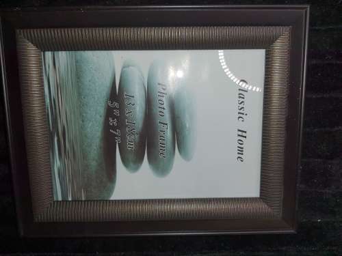 A COLLECTION OF PICTURE FRAMES SOLD AS IS