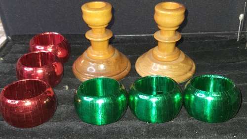 A GENUINE SET OF TWO PJ VAN RHEENEN STINK WOOD CANDLE STANDS AND A SET OF SIX MULTI COLOURED NAPKIN