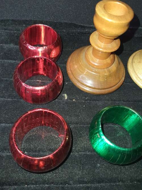 A GENUINE SET OF TWO PJ VAN RHEENEN STINK WOOD CANDLE STANDS AND A SET OF SIX MULTI COLOURED NAPKIN