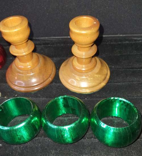 A GENUINE SET OF TWO PJ VAN RHEENEN STINK WOOD CANDLE STANDS AND A SET OF SIX MULTI COLOURED NAPKIN