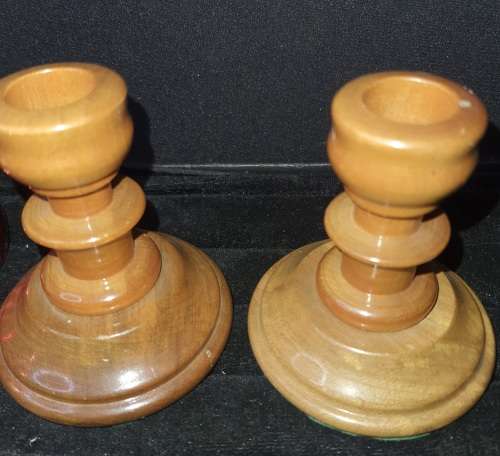 A GENUINE SET OF TWO PJ VAN RHEENEN STINK WOOD CANDLE STANDS AND A SET OF SIX MULTI COLOURED NAPKIN