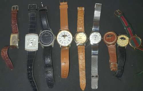 A VINTAGE COLLECTION OF QUARTZ WATCHES SOLD AS IS NOT TESTED