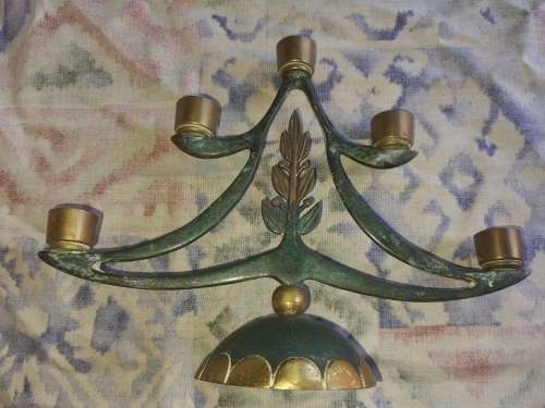 A BEAUTIFUL WRATH IRON AND BRASS MINORA IN GOOD CONDITION SOLD AS IS