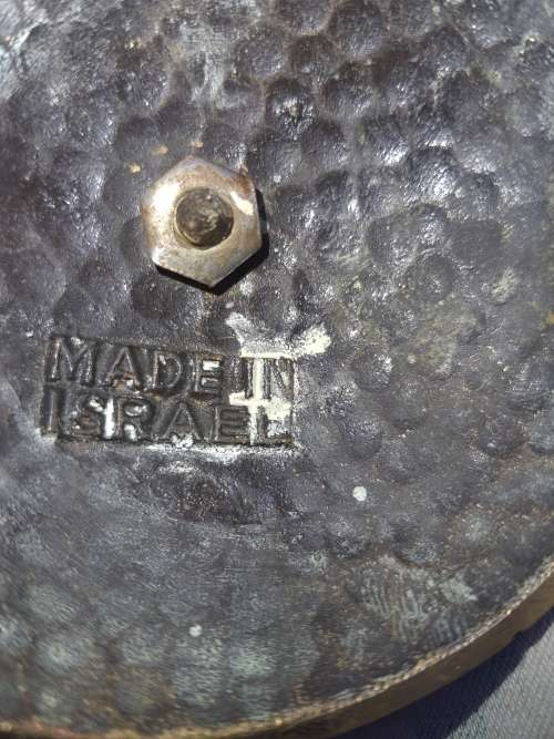A BEAUTIFUL WRATH IRON AND BRASS MINORA IN GOOD CONDITION SOLD AS IS